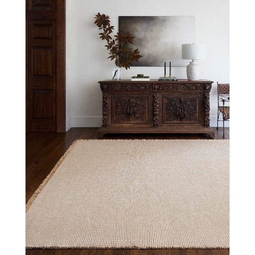 AAAB8160-styleshot_201_5809bcf4-20a2-4e8e-b47a-5d791460e87b-1 Kimi Solid and Border Mocha Area Rug - Becki Owens x Livabliss - Image 1