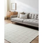 Ishaq Solid and Border Ivory Area Rug