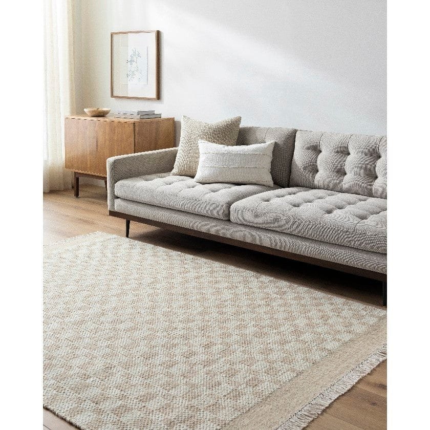 AAAB8706-576-roomscene_201-1 Clinten Solid and Border Tan Area Rug - Image 1