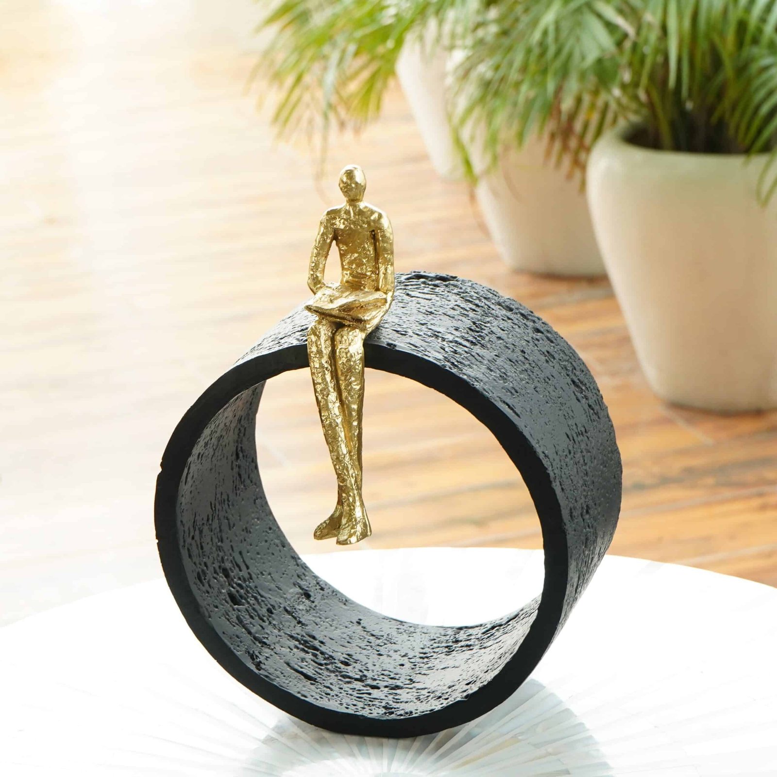 DSC04920 Black & Gold Circular Focused Sitting Figure Sculpture - Image 1