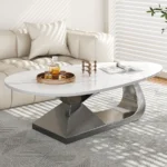 Modern sintered stone coffee table with stainless steel base in a stylish living room setting