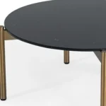 Goldoma 36-inch black and gold faux marble round coffee table in a modern living room setting