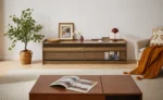 Goldoma modern TV stand with LED lights and charging ports for TVs up to 75 inches featuring four drawers and tempered glass top