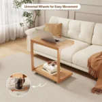 Goldoma C-shaped end table with lockable wheels in natural wood finish, placed under a sofa as a rolling side table