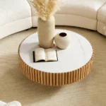 Goldoma nesting round coffee table with sintered stone top in a modern living room setting
