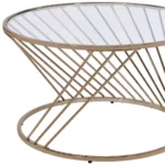 Goldoma 32-inch round tempered glass coffee table with champagne metal base in a modern living room