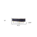 White and gold oval coffee table with drawer and stone top in modern living room