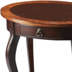 Goldoma brown wood oval coffee table with drawer and shelf in a farmhouse living room