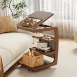 Goldoma C-Shaped End Table with lockable wheels and adjustable top in a modern living room setting