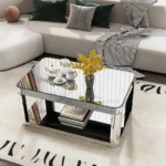Goldoma lift top coffee table with baked curved mirror surface and wood frame in a modern living room