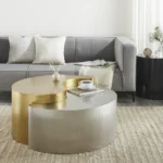 Modern gold coffee table with steel frame and metal top in a living room setting