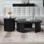 Goldoma modern round coffee table with hammered glass top and wood accents in a living room
