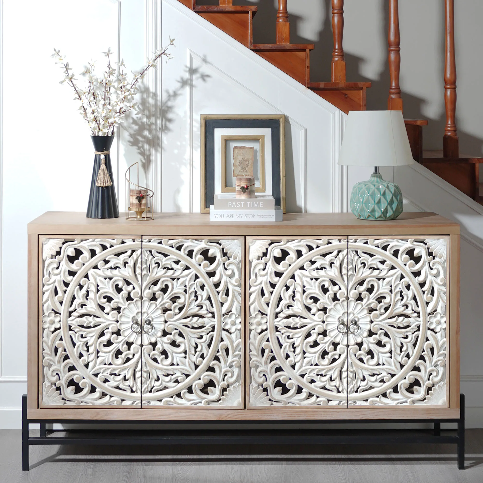H224b380eb9b7469f8a15deb49fdf1f94j.webp Goldoma vintage carved wood console table with floral doors and black metal base in a living room entryway as a storage sideboard