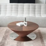 Goldoma modern marbling wood coffee table with round wood top and stainless steel base in a living room
