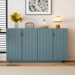Antique blue sideboard with wave doors and vintage copper handles in a midcentury modern dining room decor