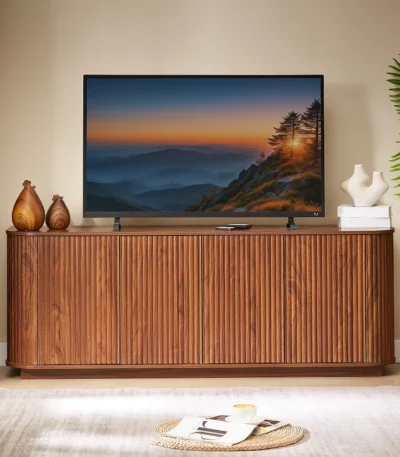Modern TV stand with wave pattern design and adjustable shelves for TVs up to 64 inches, shown in natural wood finish