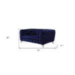 Blue velvet chesterfield loveseat with tufted cushions and silver legs in a living room