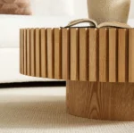 Goldoma nesting round coffee table with sintered stone top in a modern living room setting