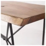 Solid acacia console table with live edge and black iron geometric base in an entryway