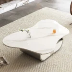 Modern butterfly coffee table with sintered stone top and storage drawer in living room