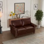 Goldoma black faux leather loveseat with memory foam cushions and wood legs in a modern living room