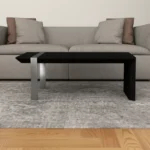 Goldoma 48-inch distressed sled coffee table in black and silver with open shelf
