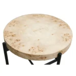 Goldoma 22-inch black and brown burl wood round end table with black metal base in a living room setting