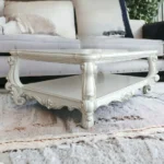 Goldoma antiqued white oak coffee table with shelf in farmhouse living room setting