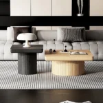 Goldoma modern nesting coffee table set in oak wood with cylindrical fluted pedestal on living room floor