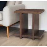 Antique brown solid wood sled end table with shelf by Goldoma, perfect for living room or bedroom