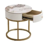 Goldoma modern nightstand with drawer featuring round marble-look sintered stone top and metal frame in a bedroom setting