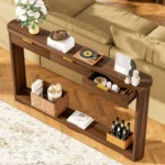 Modern console table with wavy patterned front and two storage drawers in a living room setting