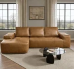 Goldoma brown faux leather cloud sectional sofa with tufted back and deep seat chaise in a modern living room