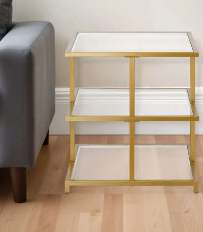 Goldoma brass and glass end table with two shelves, clear glass top, and brass steel base for living room