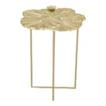 Gold end table with cross legs in a modern living room setting