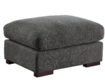 U-shaped sectional sofa with two ottomans and reclining seats in a modern living room