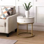 Goldoma modern nightstand with drawer featuring round marble-look sintered stone top and metal frame in a bedroom setting