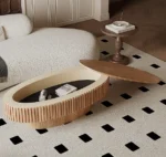 Goldoma 43.7-inch oval drum coffee table in walnut finish with solid wood top and MDF base on a modern living room floor