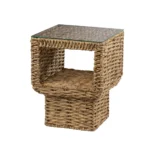 Goldoma rattan end table with clear glass top in a living room setting