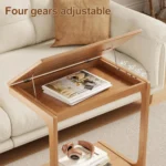 Goldoma C-shaped end table with lockable wheels in natural wood finish, placed under a sofa as a rolling side table