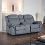 Goldoma velvet reclining loveseat with tufted back and storage armrests in a modern living room