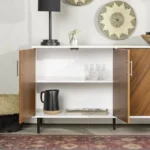 Goldoma mid-century console table with faux-bookmatch doors in white and teak, featuring two cabinets and metal legs, placed in a living room setting