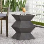 Goldoma lightweight concrete outdoor side table with geometric design on a patio