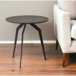 Goldoma 20 inch black and gray ceramic round end table with black iron base in a modern living room setting