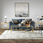 Goldoma 54 inch gold glass and steel coffee table with two shelves in living room