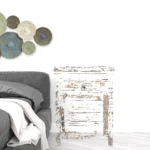 White distressed solid wood nightstand with drawer in bedroom setting