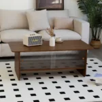 Goldoma 47-inch modern minimalist coffee table with storage cabinet and glass sliding doors in a living room setting
