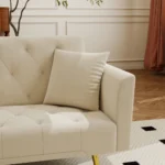 Modern 72-inch convertible sofa bed velvet tufted loveseat in beige, converted to bed mode in a living room