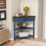 Goldoma solid wood corner table in navy blue with three tiers in a living room corner