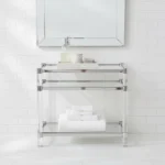 Goldoma 3-tier acrylic coffee table with tempered glass top and stainless steel frame in a modern living room setting